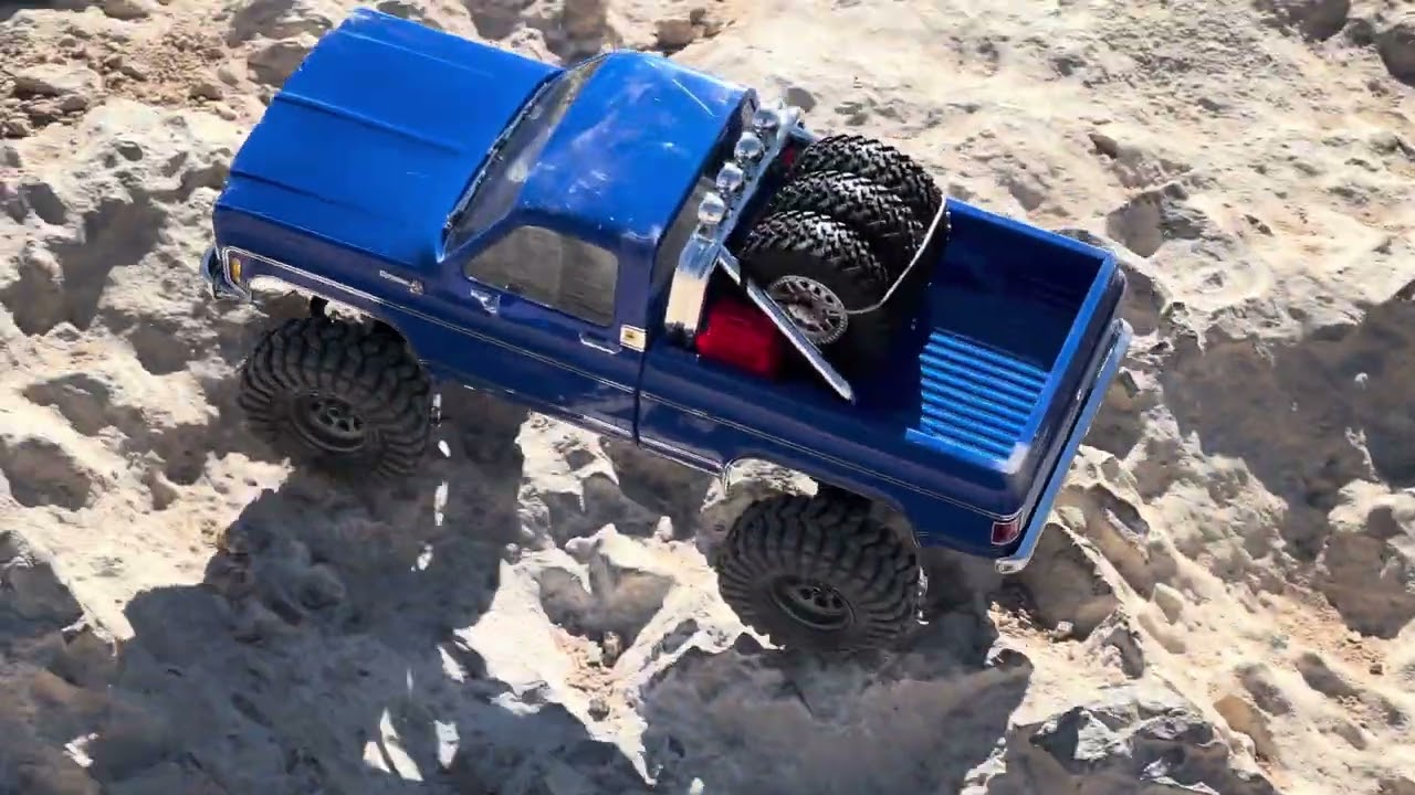 Traxxas trx4m high trail takes a beating on a tough trail.