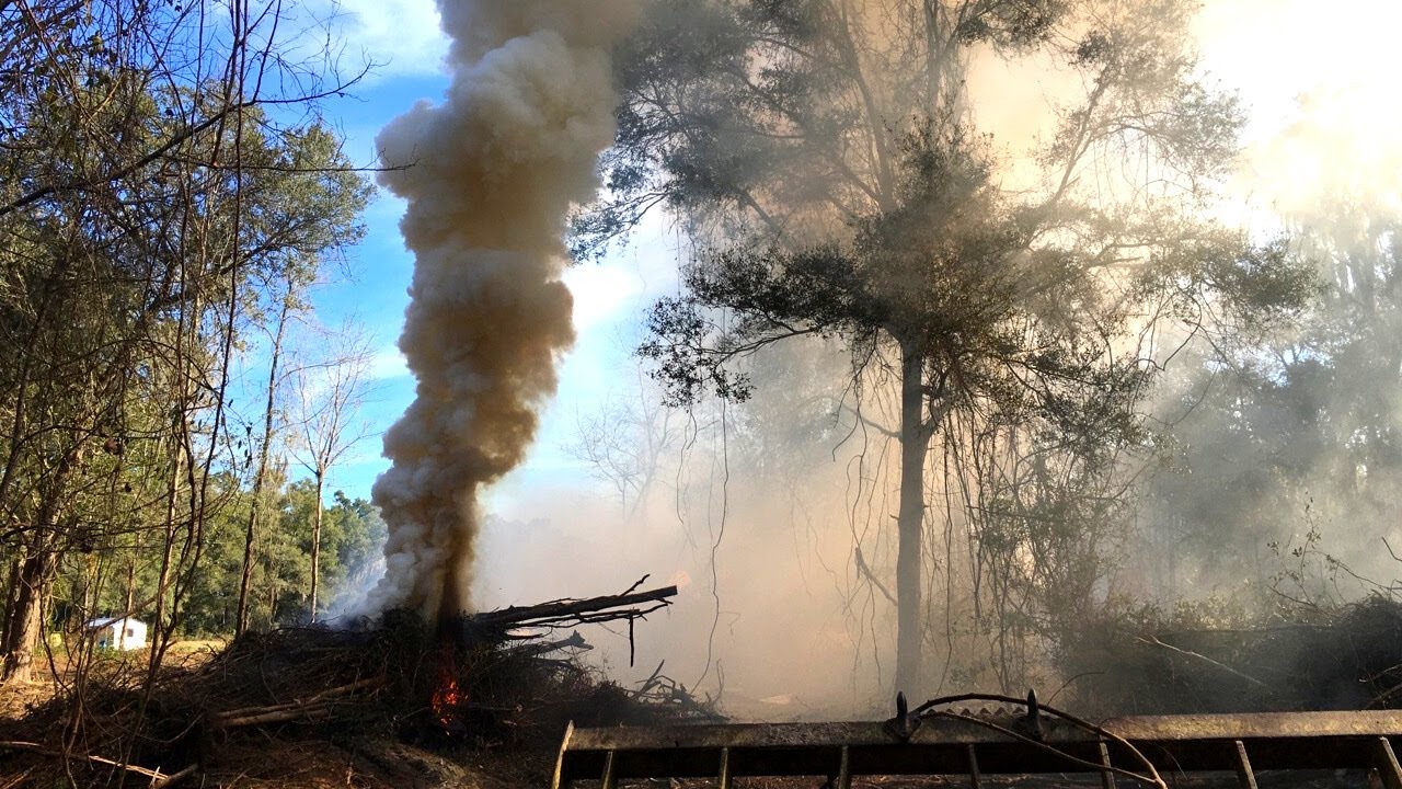 Land Clearing: Piling up and burning a giant brush pile