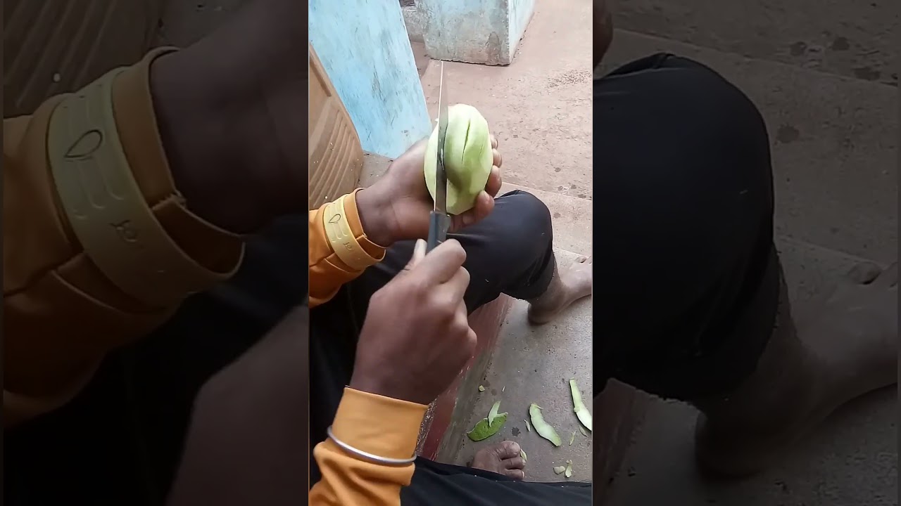 Raw mango cutting 