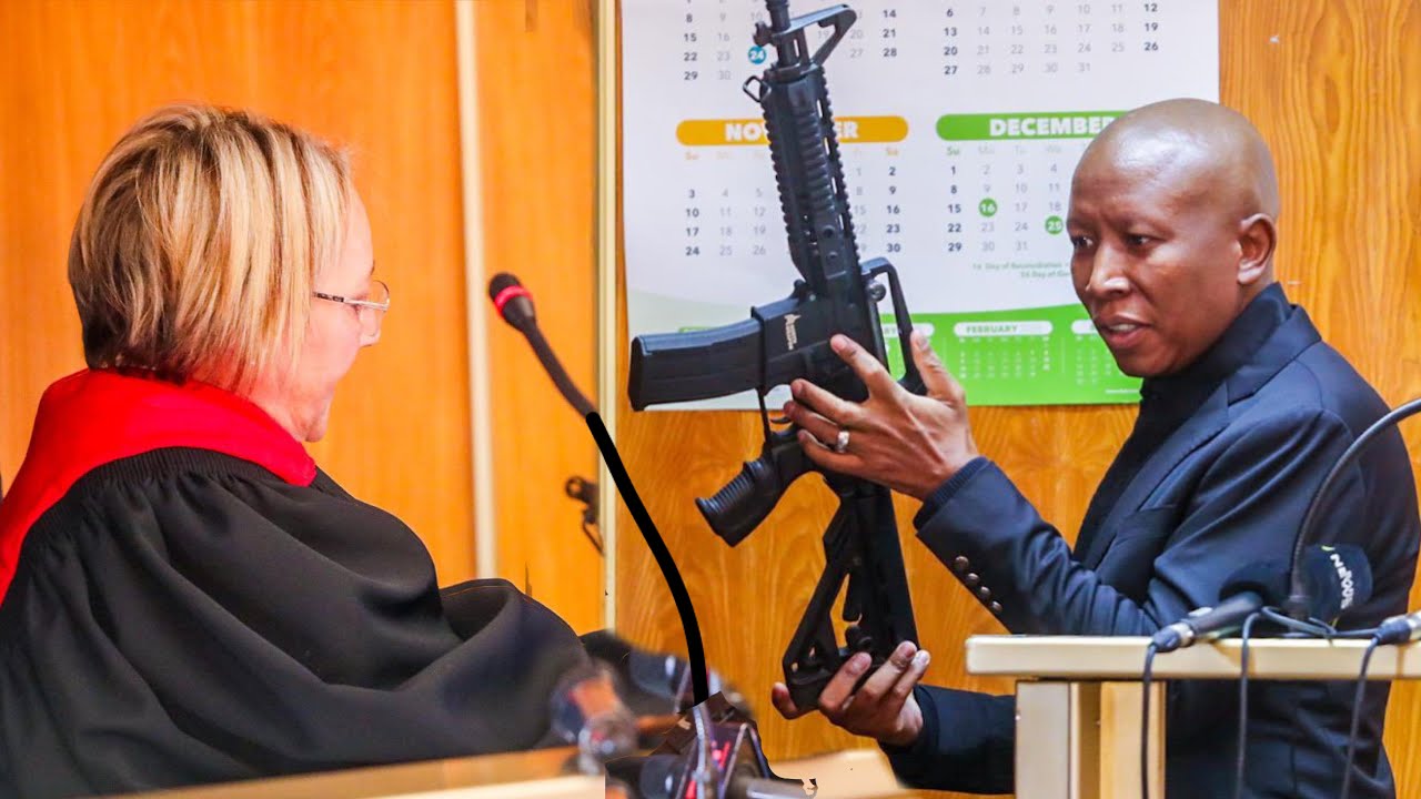 JULIUS MALEMA GIVES THE JUDGE THE TOY GUN IN COURT AS EVIDENCE