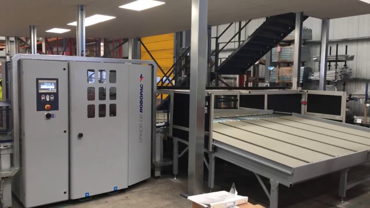 Automated sortation conveyor systems with inline wrapping