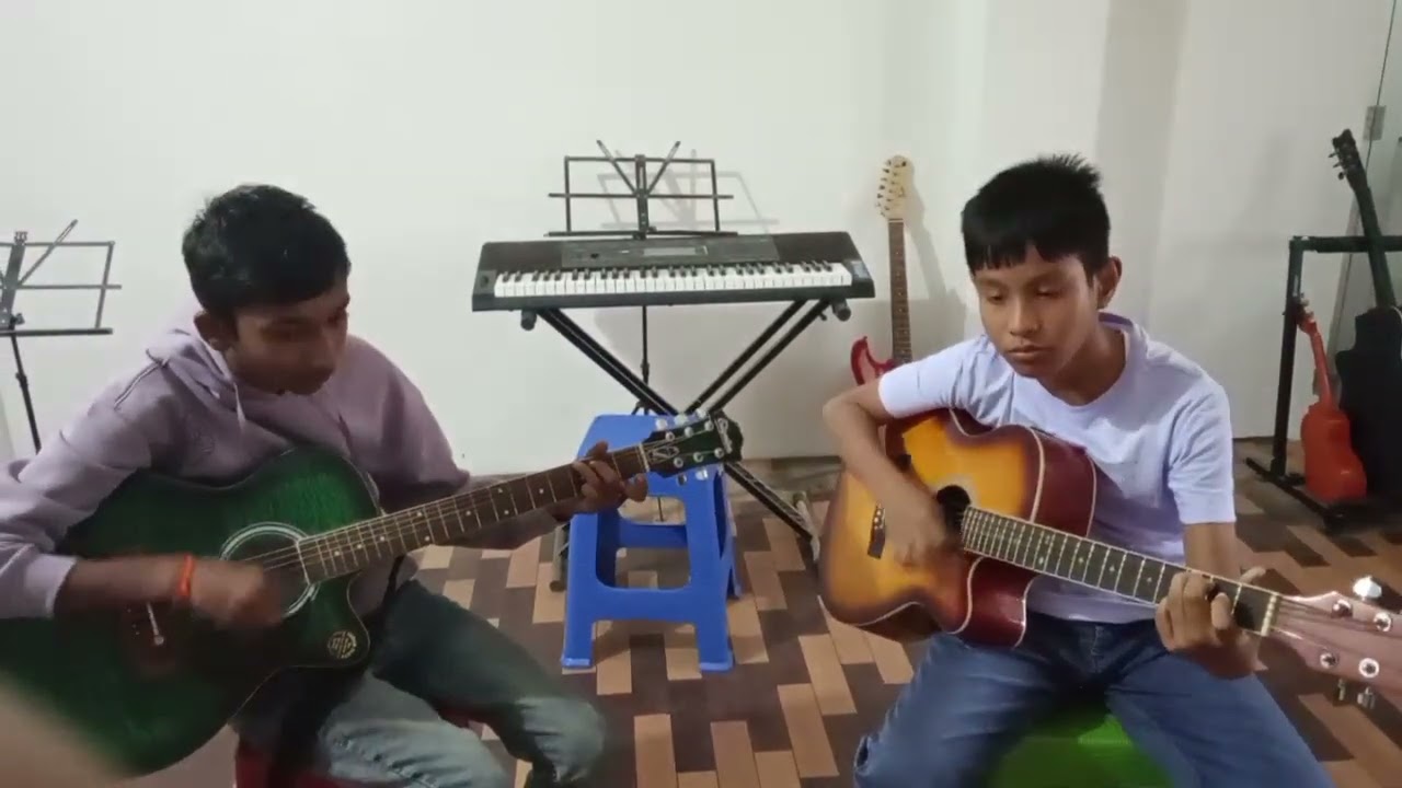 Junior Guitar students.By Mr.Suman & George . Title Choo kar mere maan ko.