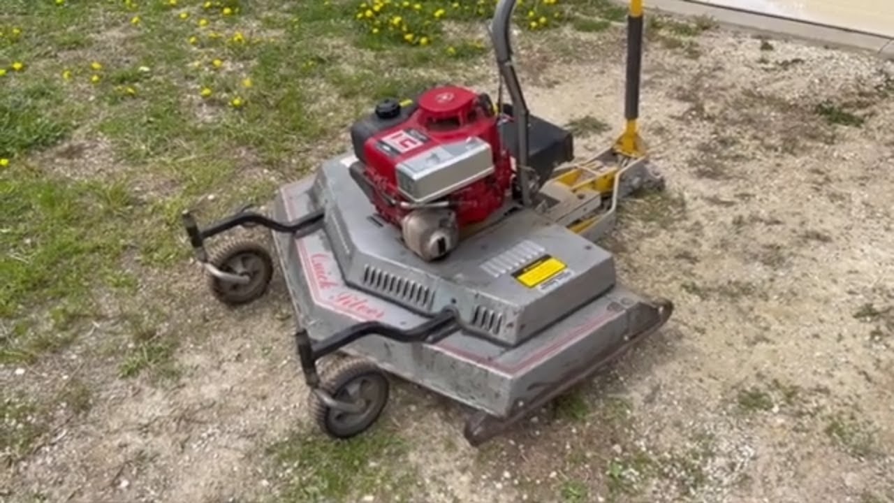 Quick Silver finish mower mounted on the front of an ATV | Belted Galloway Homestead