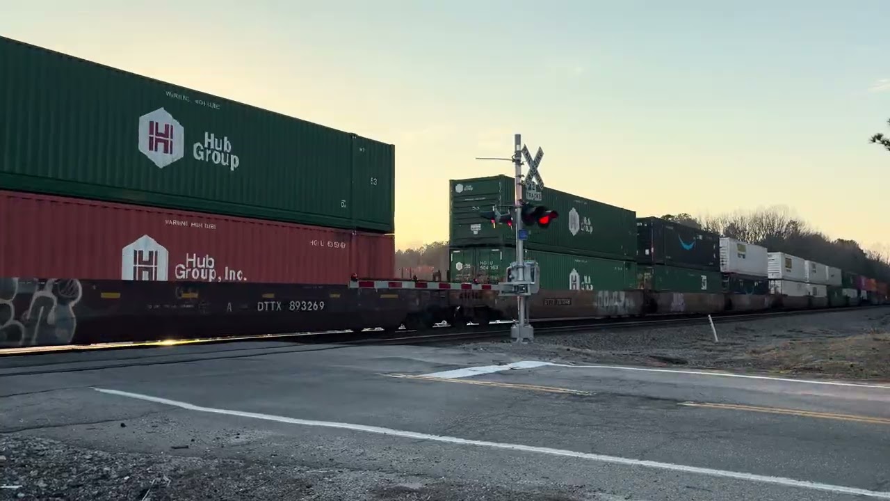 NS 276 passing near New Bohemia with a BNSF war bonnet as mid dpu!