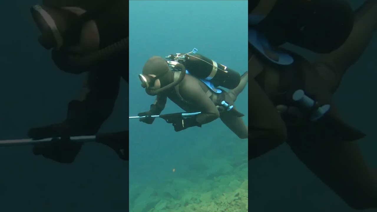 Spectre Frogman In Vintage Scuba firing Speargun wearing Beavertail Smooth skin Wetsuit