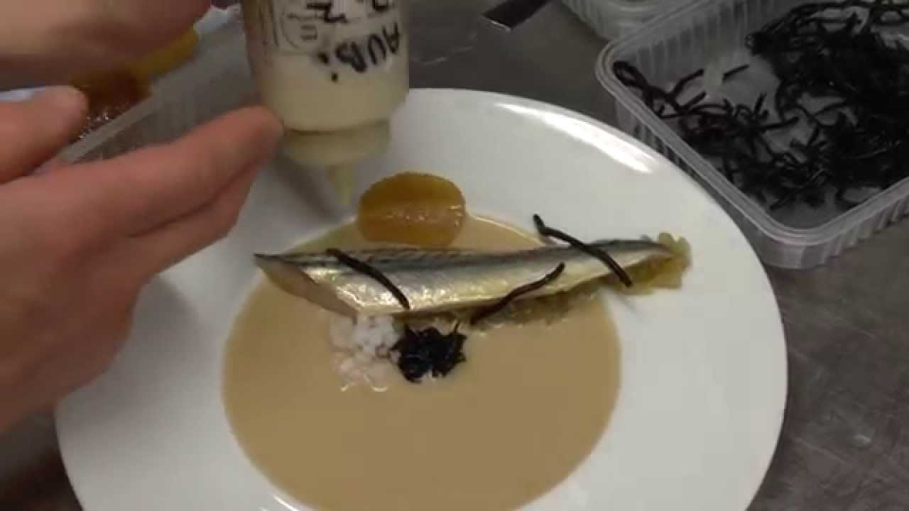 Micha&euml;l Vrijmoed prepares a starter at his Michelin star restaurant Vrijmoed