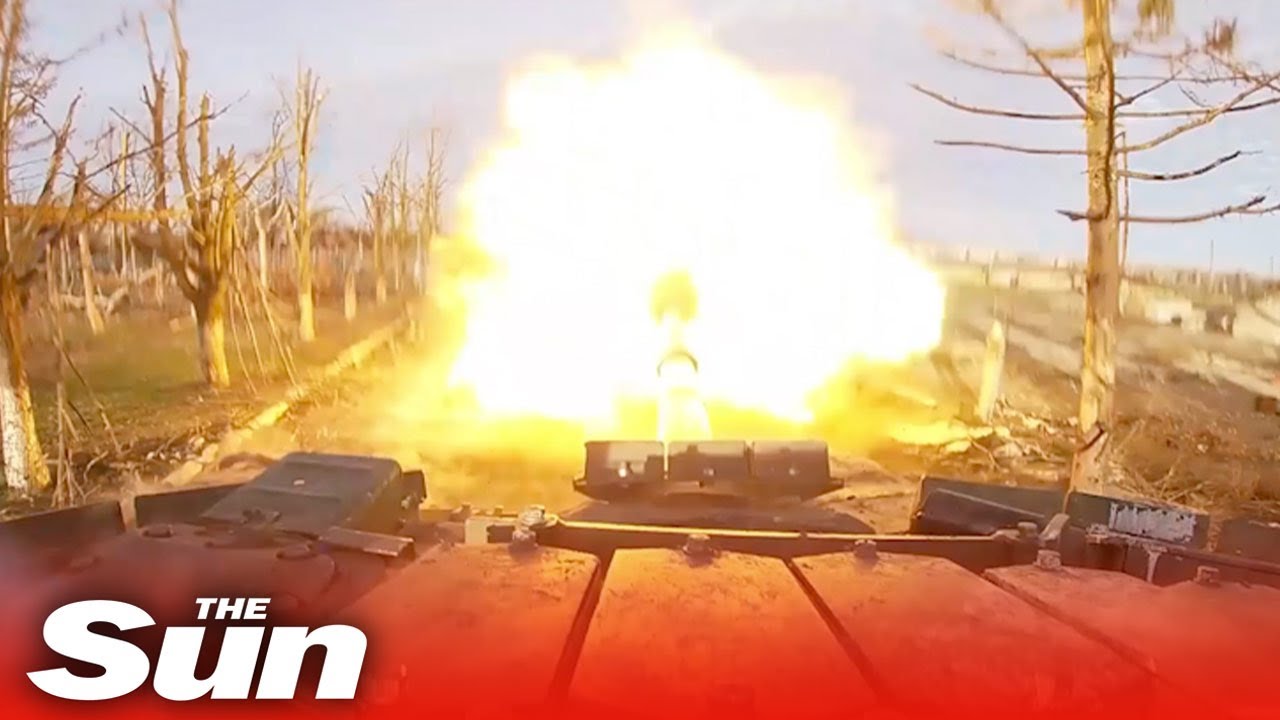 Russian armoured combat tanks blast Ukrainian military positions