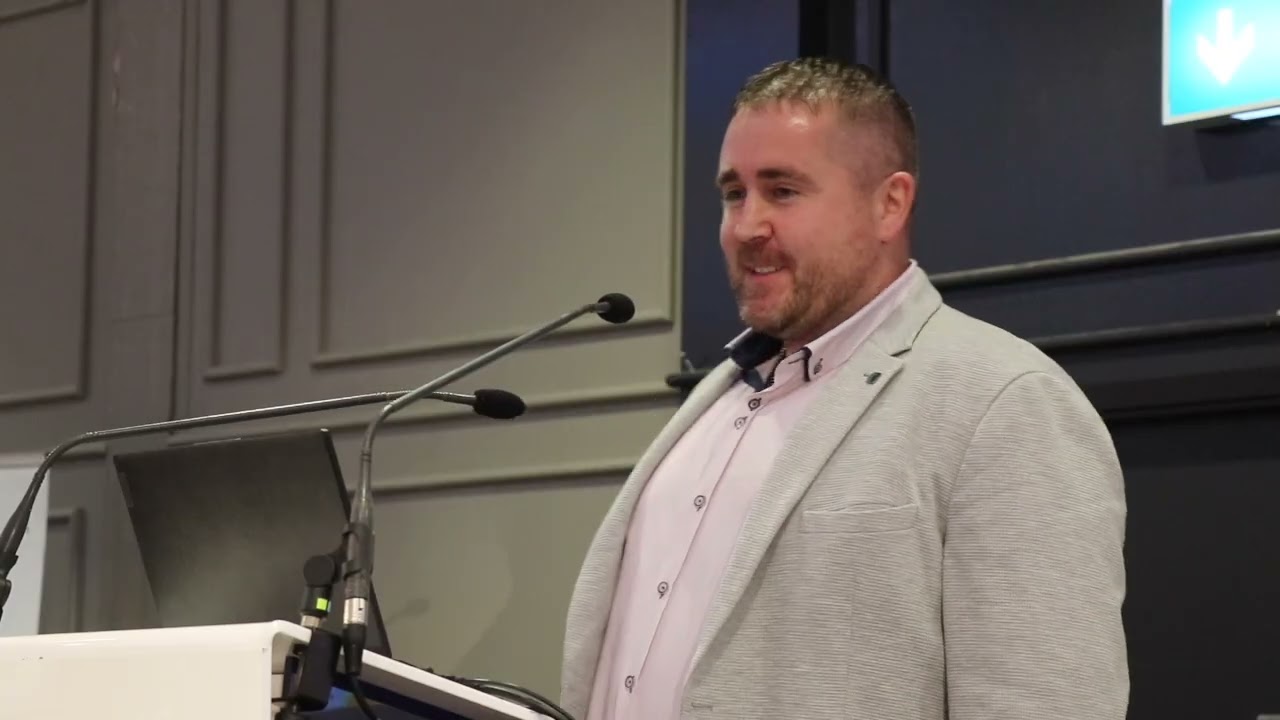 Damian Quinn from Galway addresses fellow community workers at 'In Our Words'
