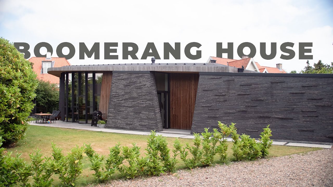 Inside a Minimalistic Home Designed as a Boomerang