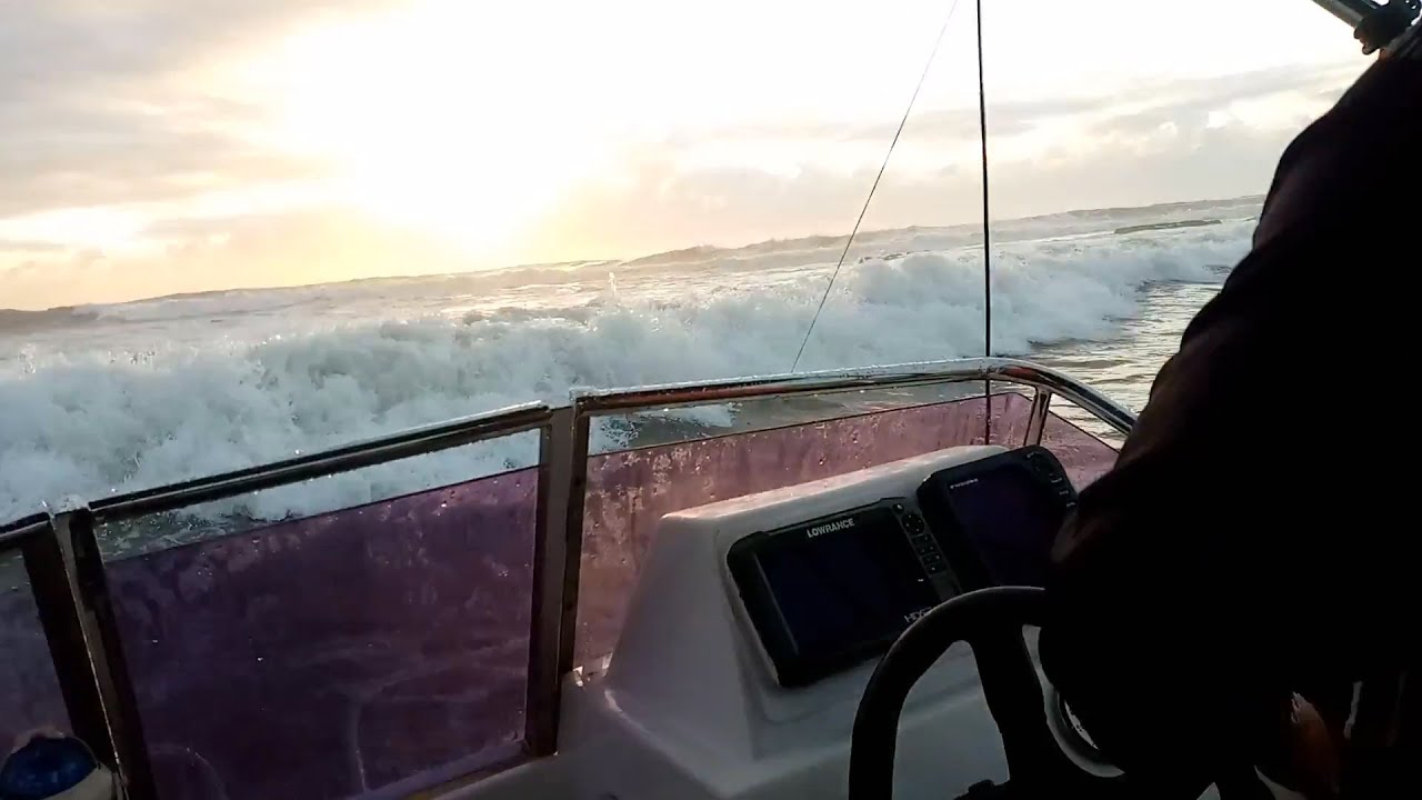 Launching through BIG waves at Shelly Beach