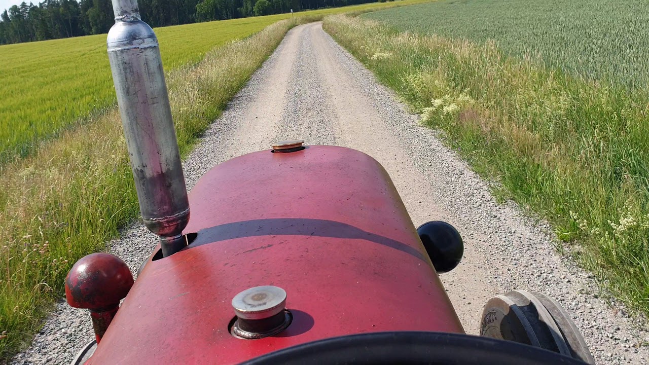 David Brown Cropmaster (Prairie) Tractor running fast (30 km/h) on a gravel road