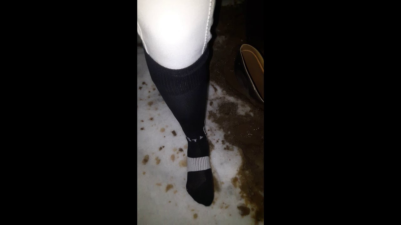 Aigle riding boots, long black socks - stuck in mud