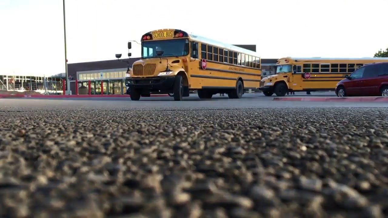 School buses driving away