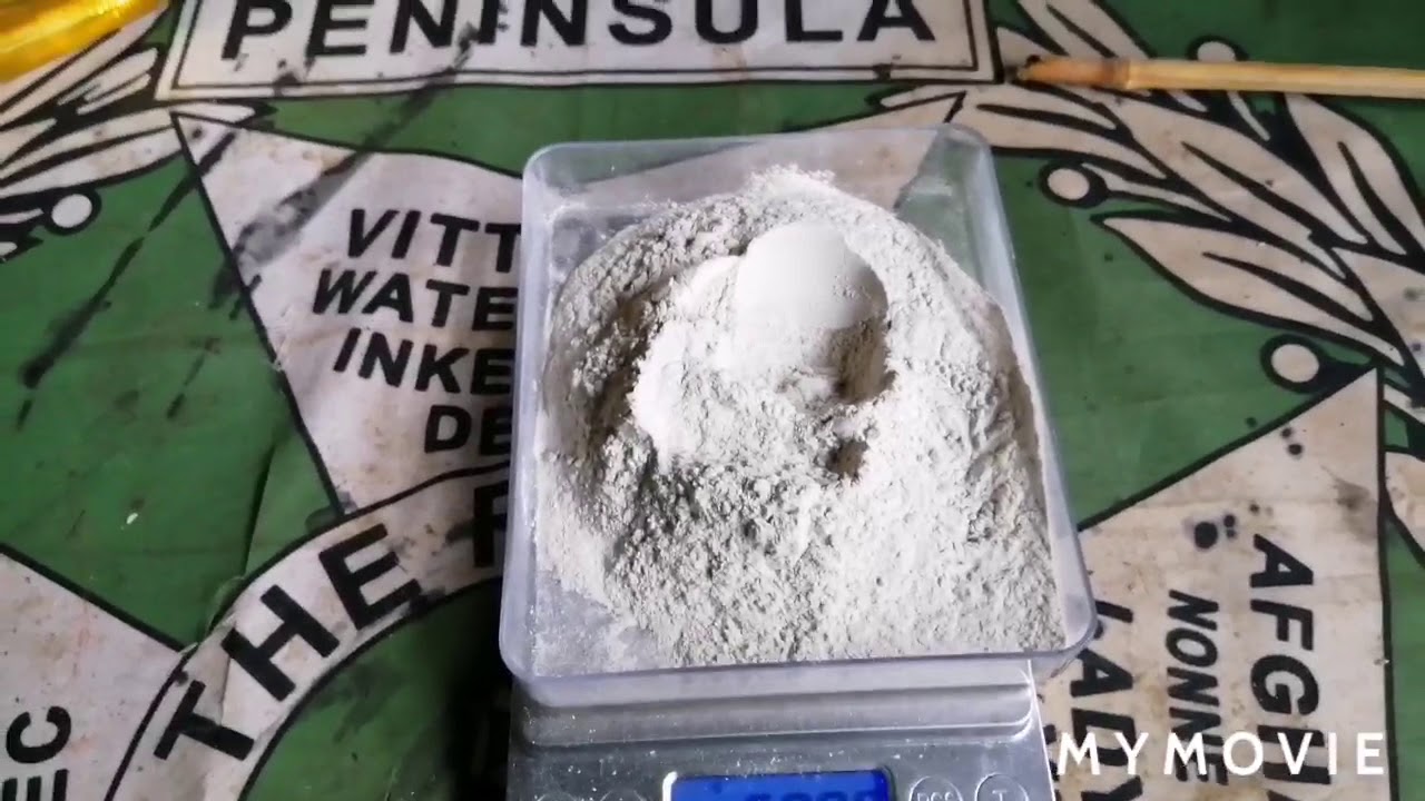 Adding kutsuri clay to my koi pond.