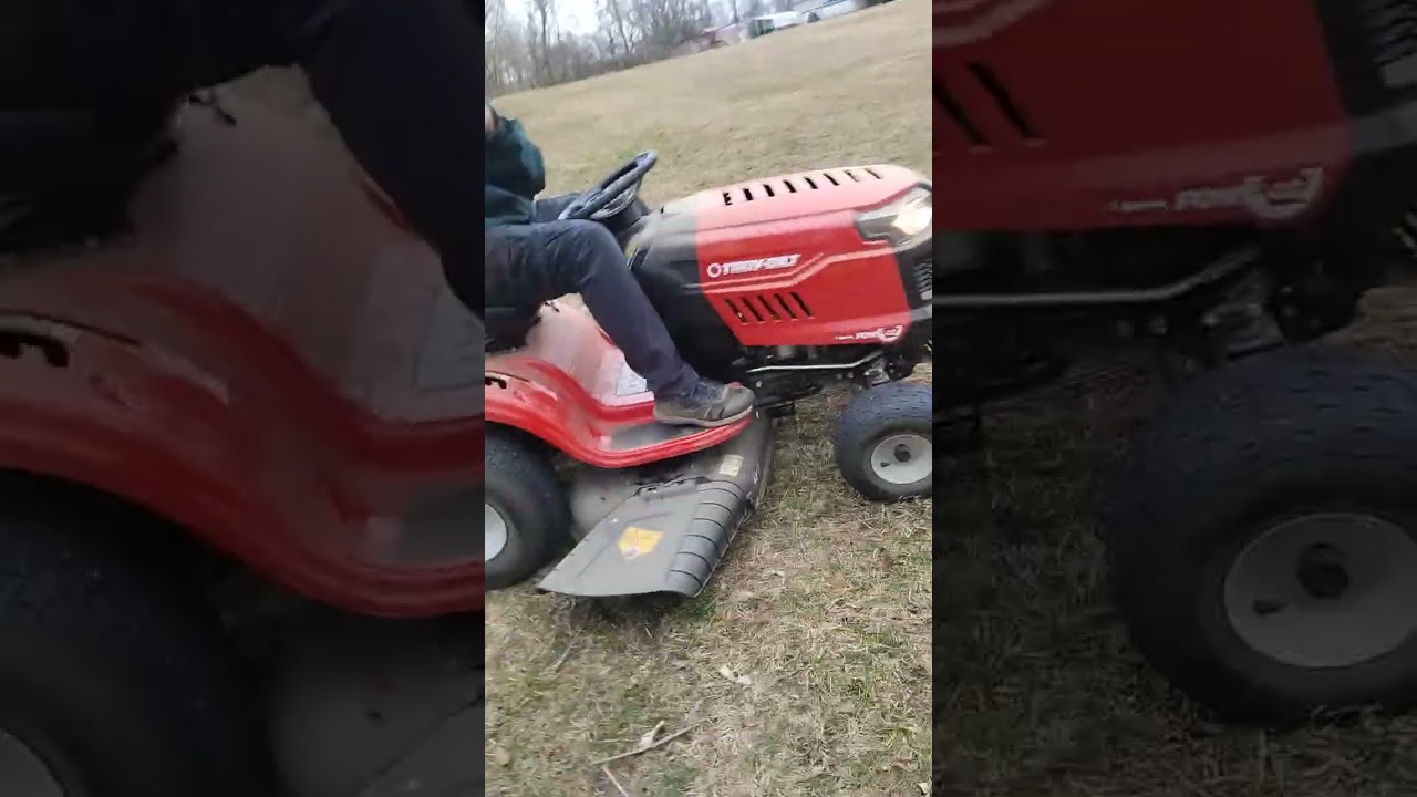Cub cadet mower working and pulling a Pontoon boat trailer 