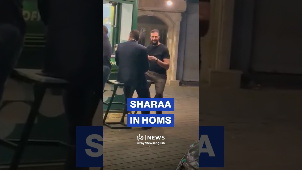 Syrian President Ahmed al-Sharaa drinks coffee from a small kiosk in Homs