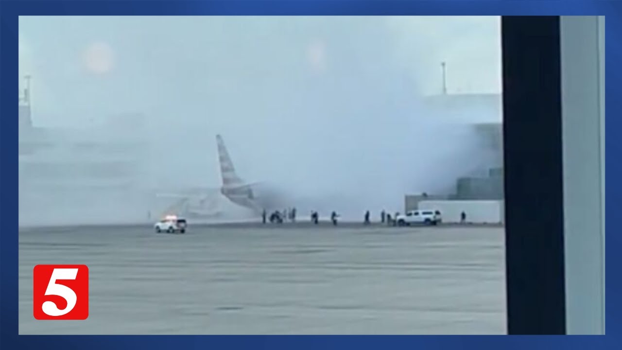 American Airlines plane catches fire at Denver International Airport