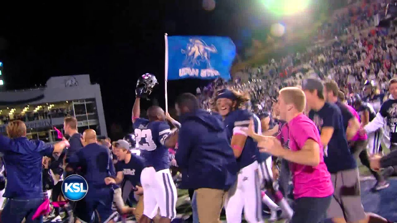 Utah State fans storm the field after defeating Boise State 52-26