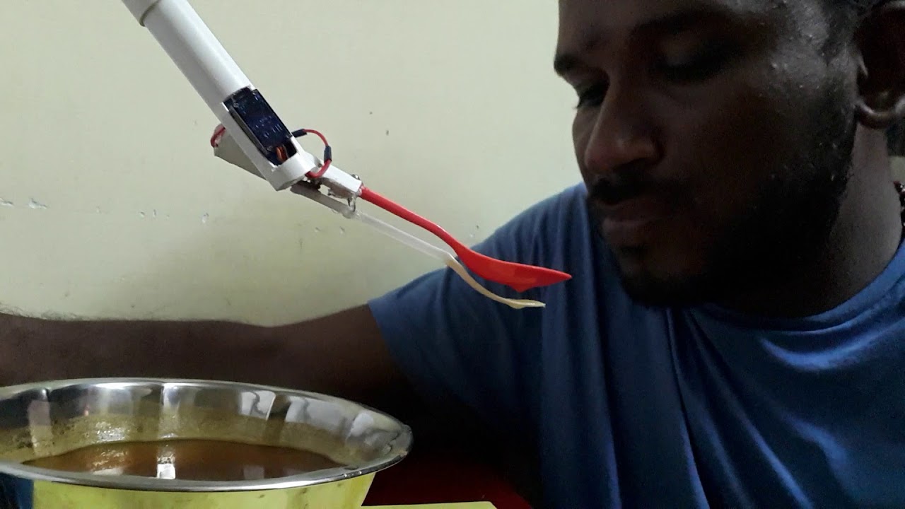 Intelligent Feeding Robotic Arm to human