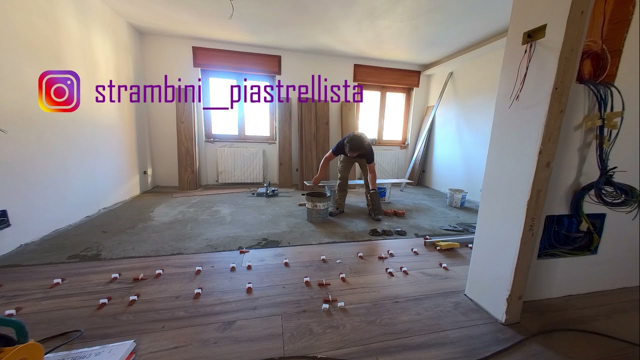 Posa e stuccatura pavimento in gres porcellanato effetto legno 25x180 cm