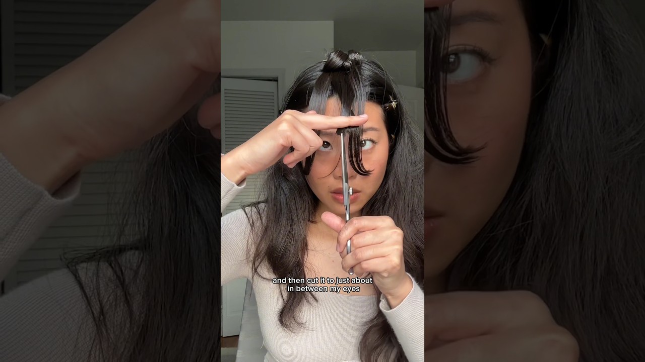 practicing cutting French bangs on myself