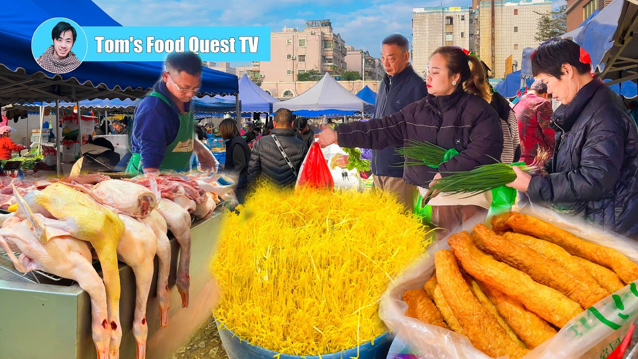 Traditional market in southern China: morning market scene with lots of vegetables and fresh meat