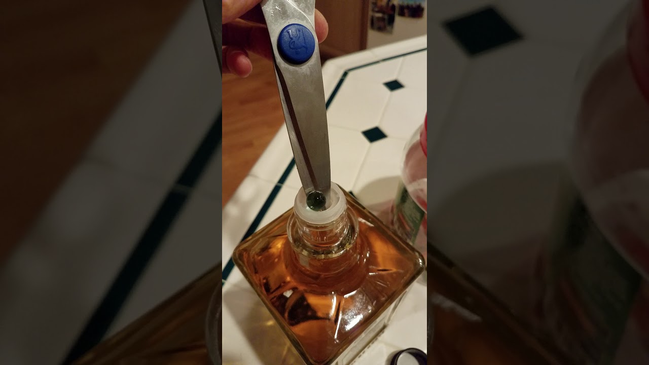 how to open Tequila Herradura bottle, metering cap