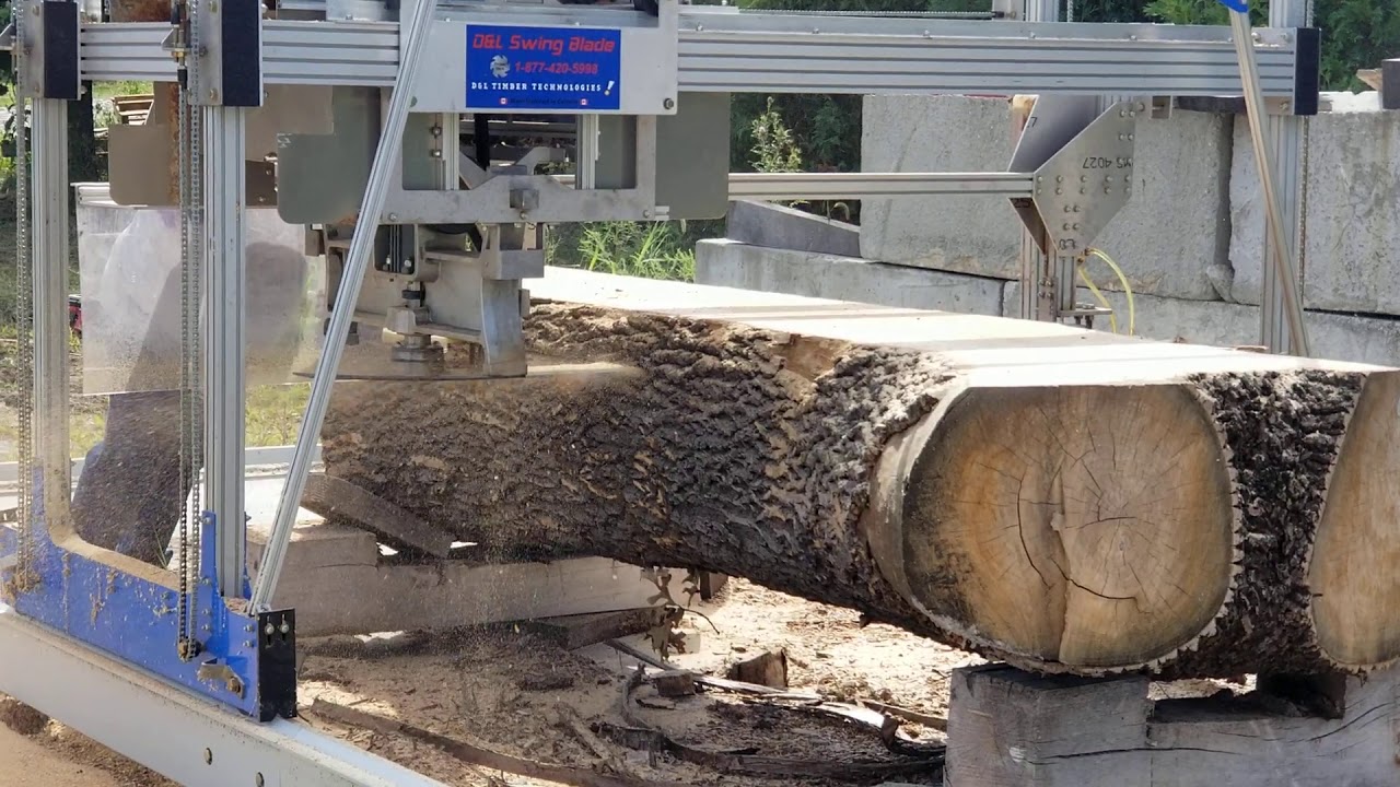 D&L mill with slabber 1020 slabbing Ash log