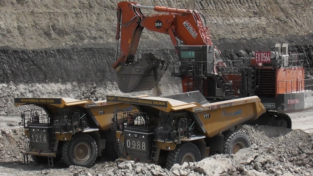 No Rest for Hitachi EX2600 Excavator Loading Overburden into CAT 777D & 777E Dump Trucks