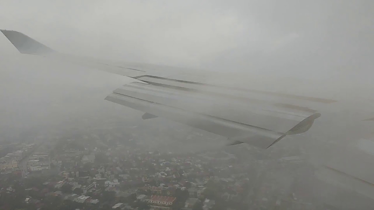 Qantas 747 landing in Sydney in bad weather QF064