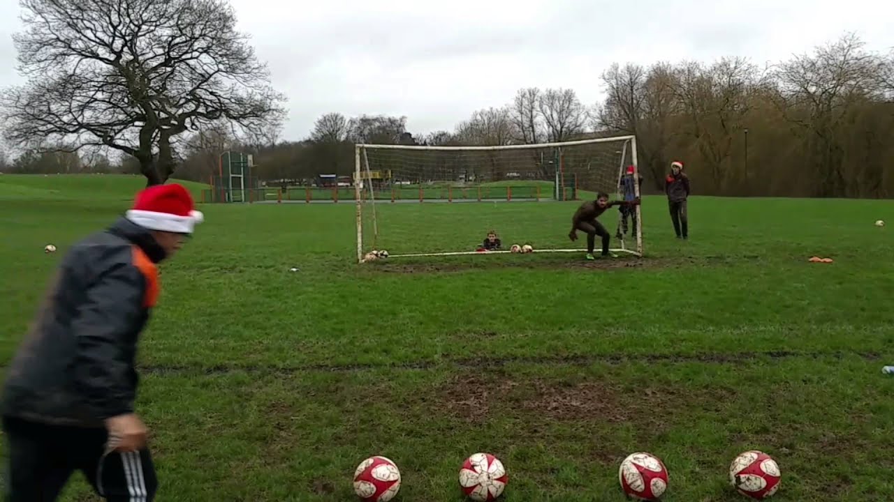 Goalkeeper coaching in the mud (diving drills)