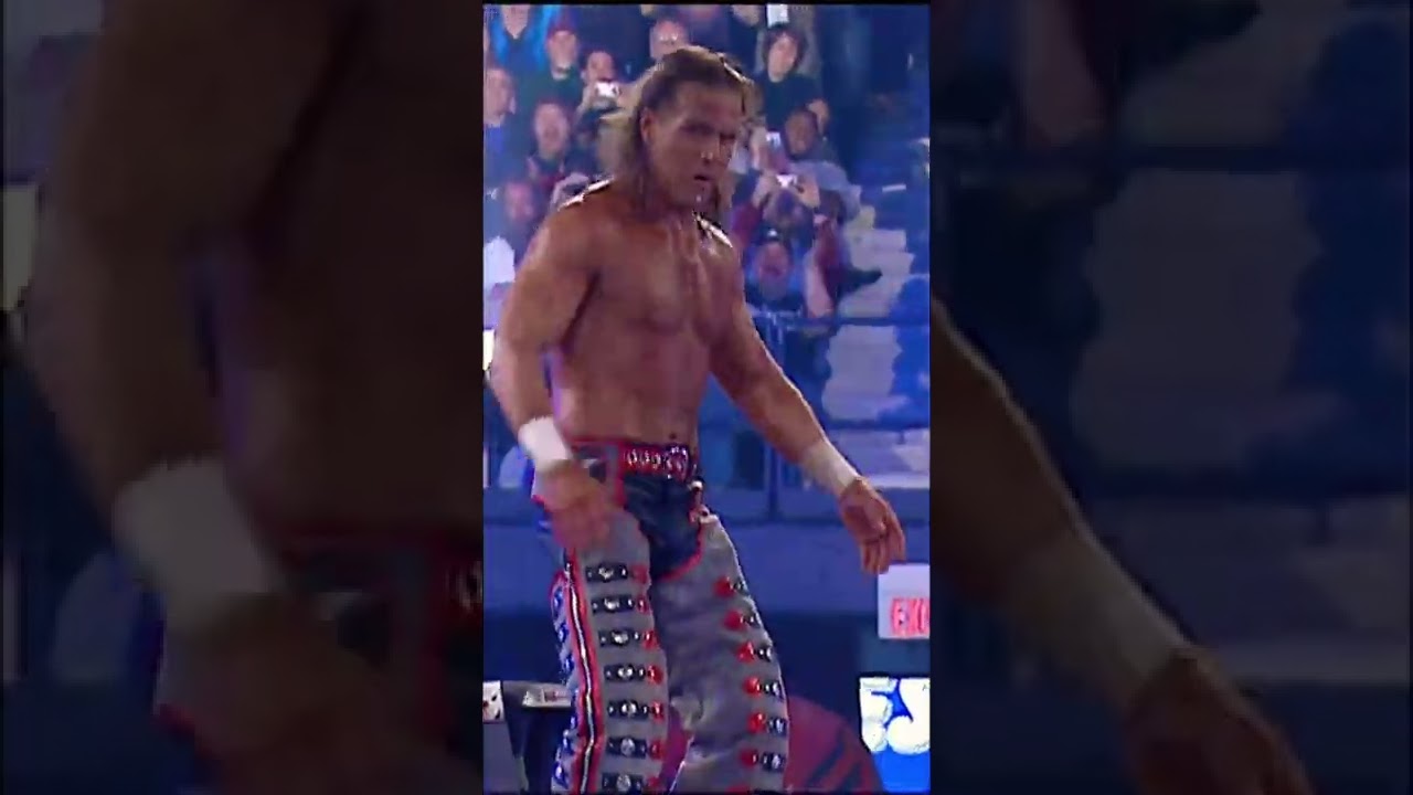 Shawn Michaels jumps off a ladder onto Mr. McMahon 