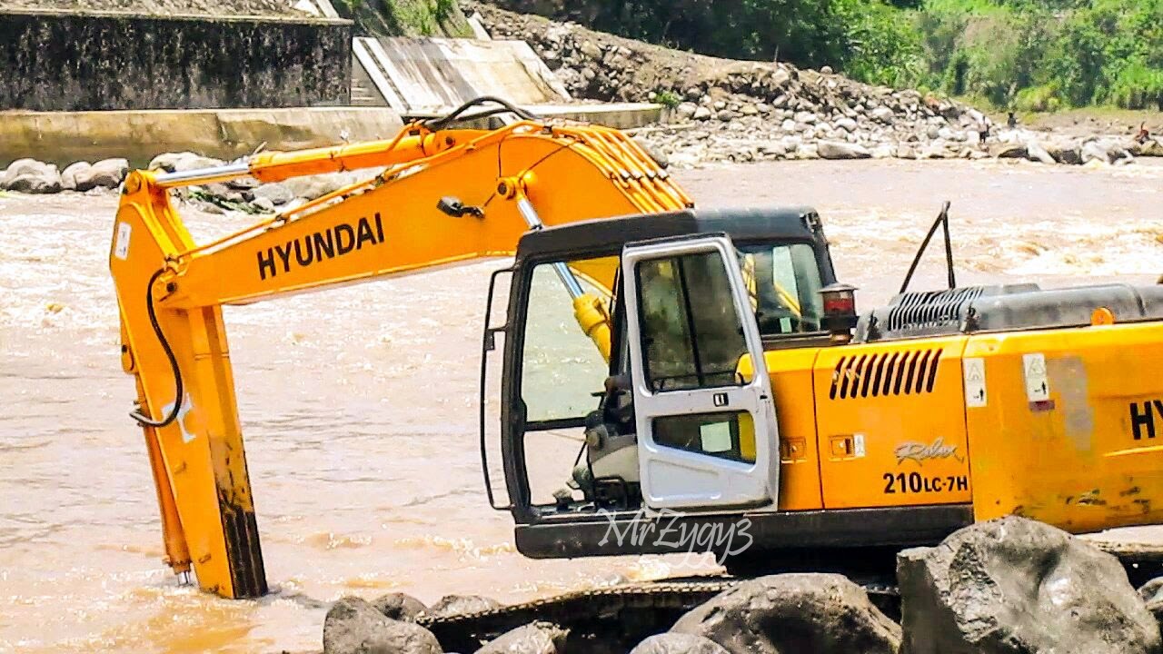 Excavators Dump Trucks Busy Working On River Dam
