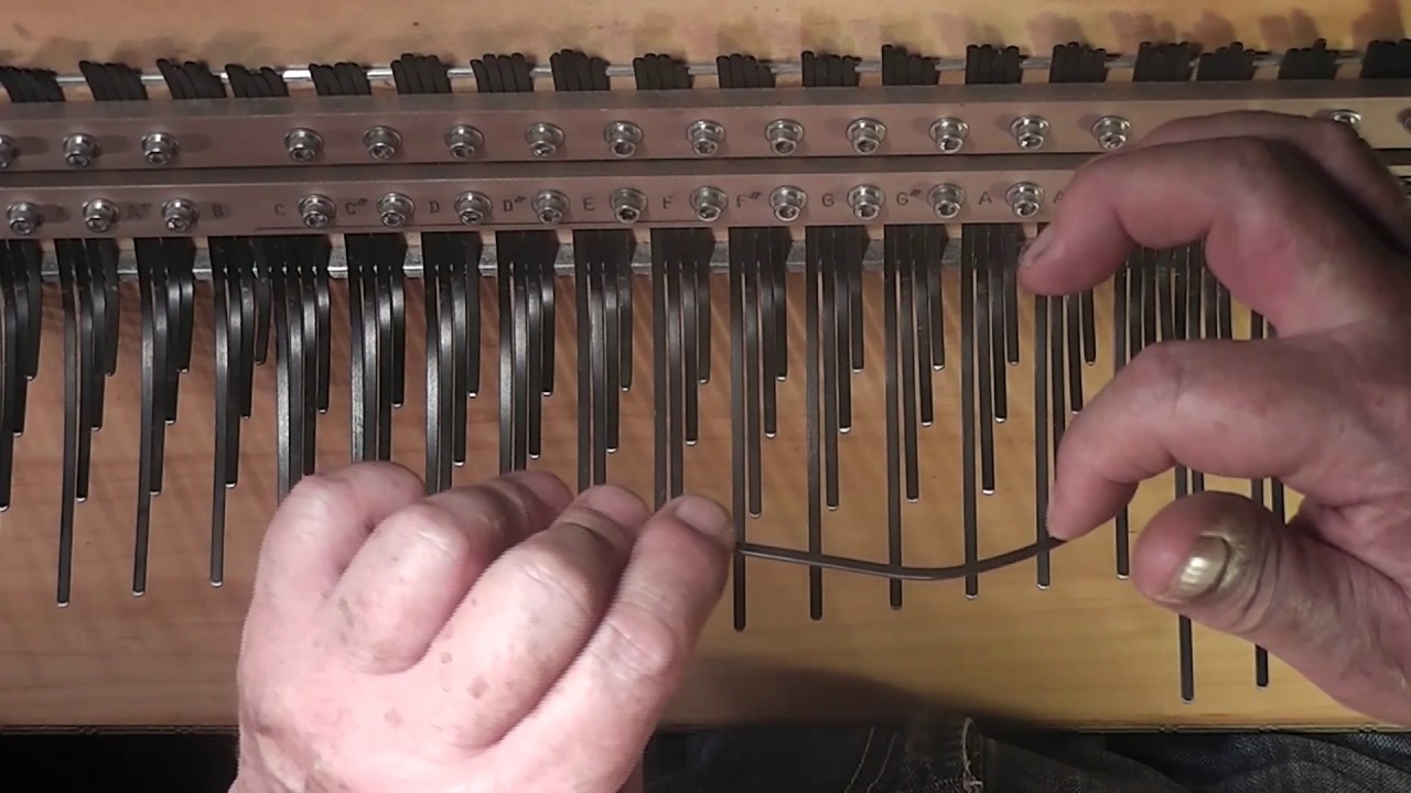 Melody Array Mbira; lesson 1, How to pluck an array mbira tine