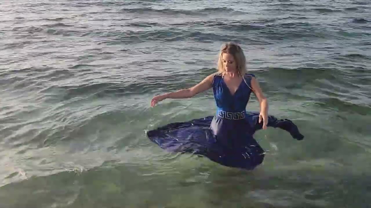 Bella goes swimming in the sea in her blue dress   Trailer