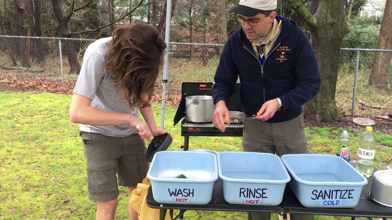 Washing Dishes in Camp