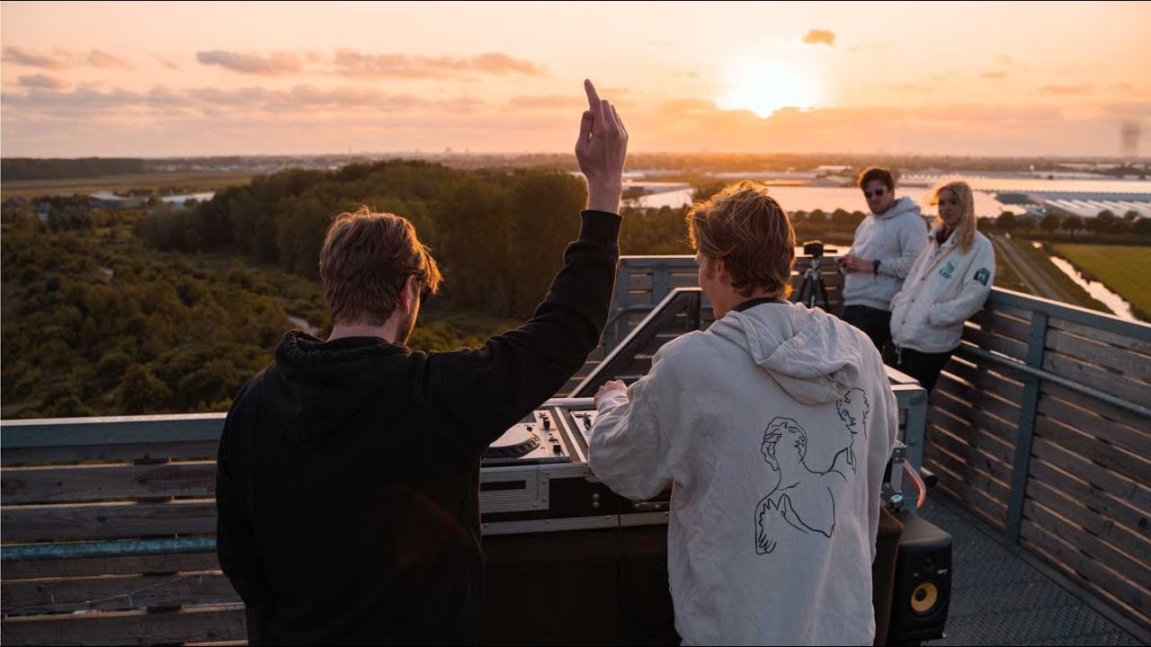 Jay Latune and Midas field live DJ Sun Set on a watchtower in Rotterdam, Netherlands
