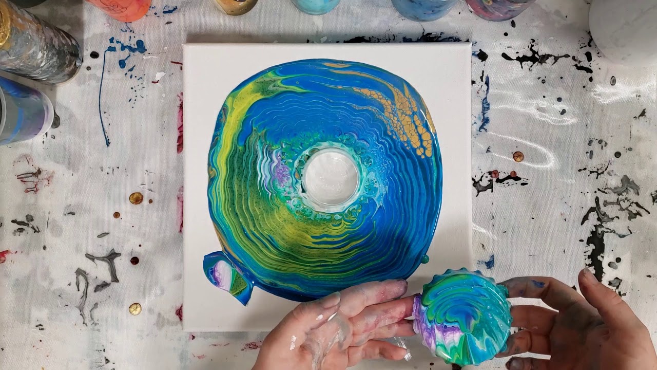 Acrylic pouring over a bottle cap magnet