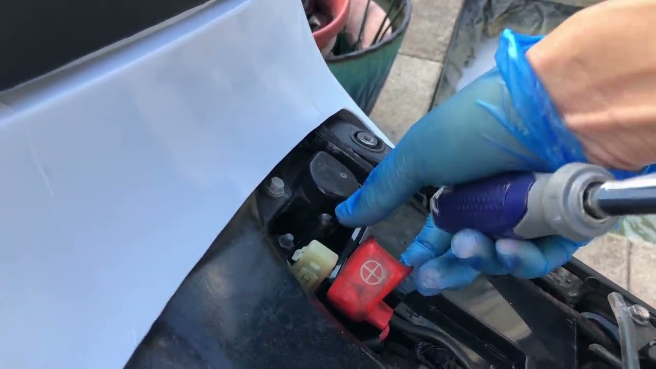 Changing battery on 2004-2007 Honda CBR1000RR with tips on how to not drop nut into motorcycle.