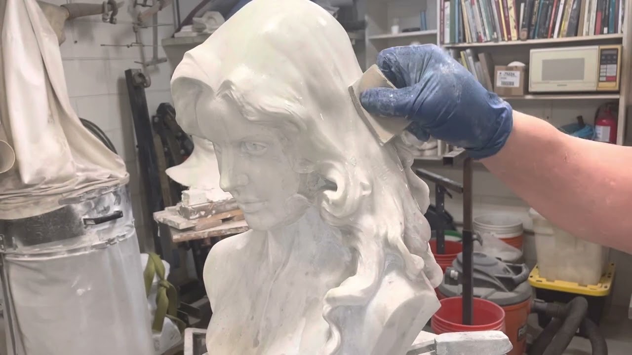 Smoothing a marble sculpture