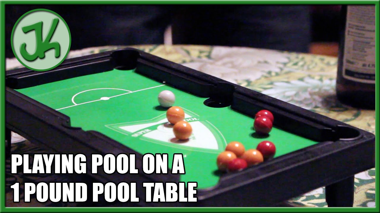 Playing Pool on a 1 Pound Pool Table