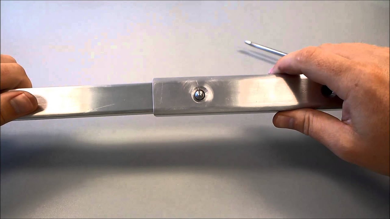 Installing Locking Button in Telescoping Tube