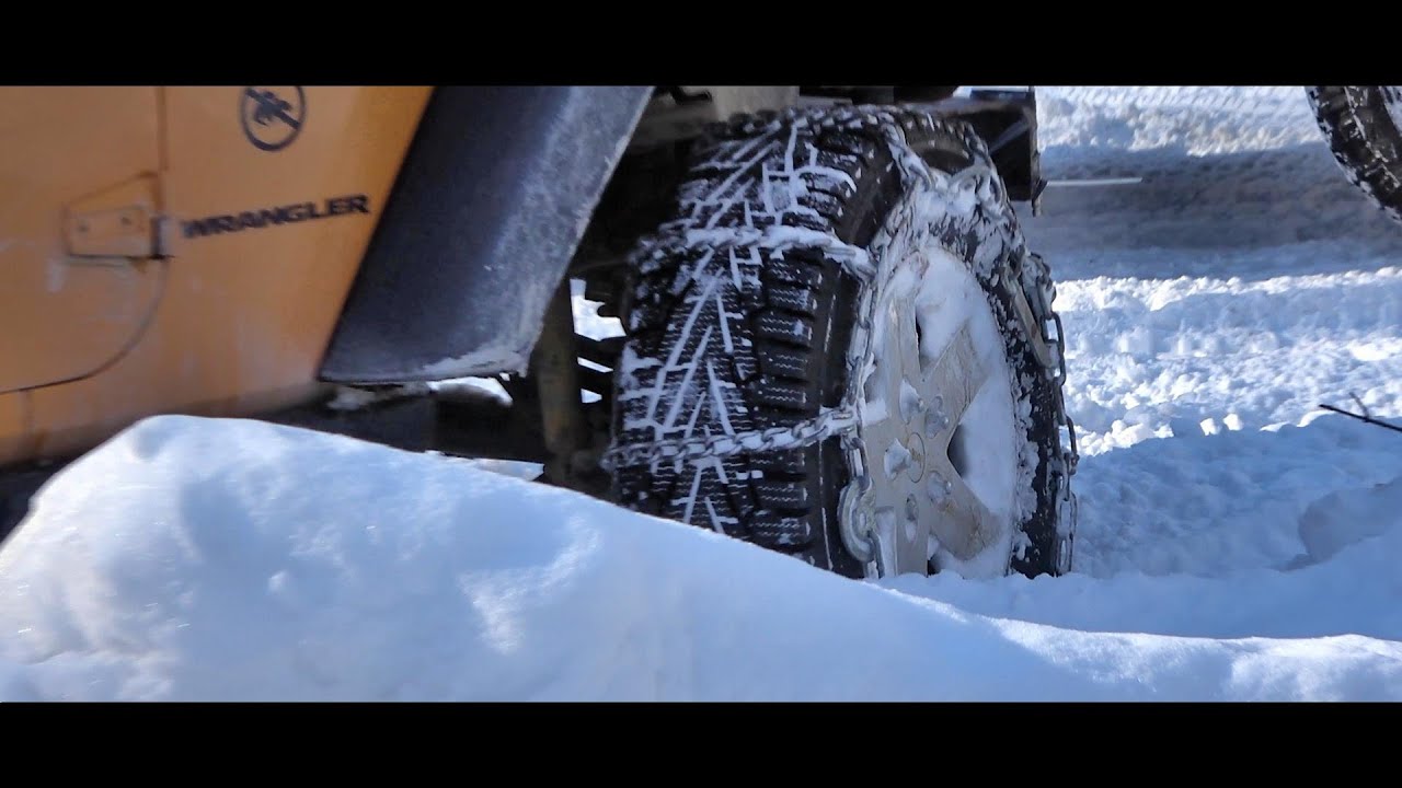 Tire chains vs no chains comparison, Jeep rubicon, steep snow covered hill.