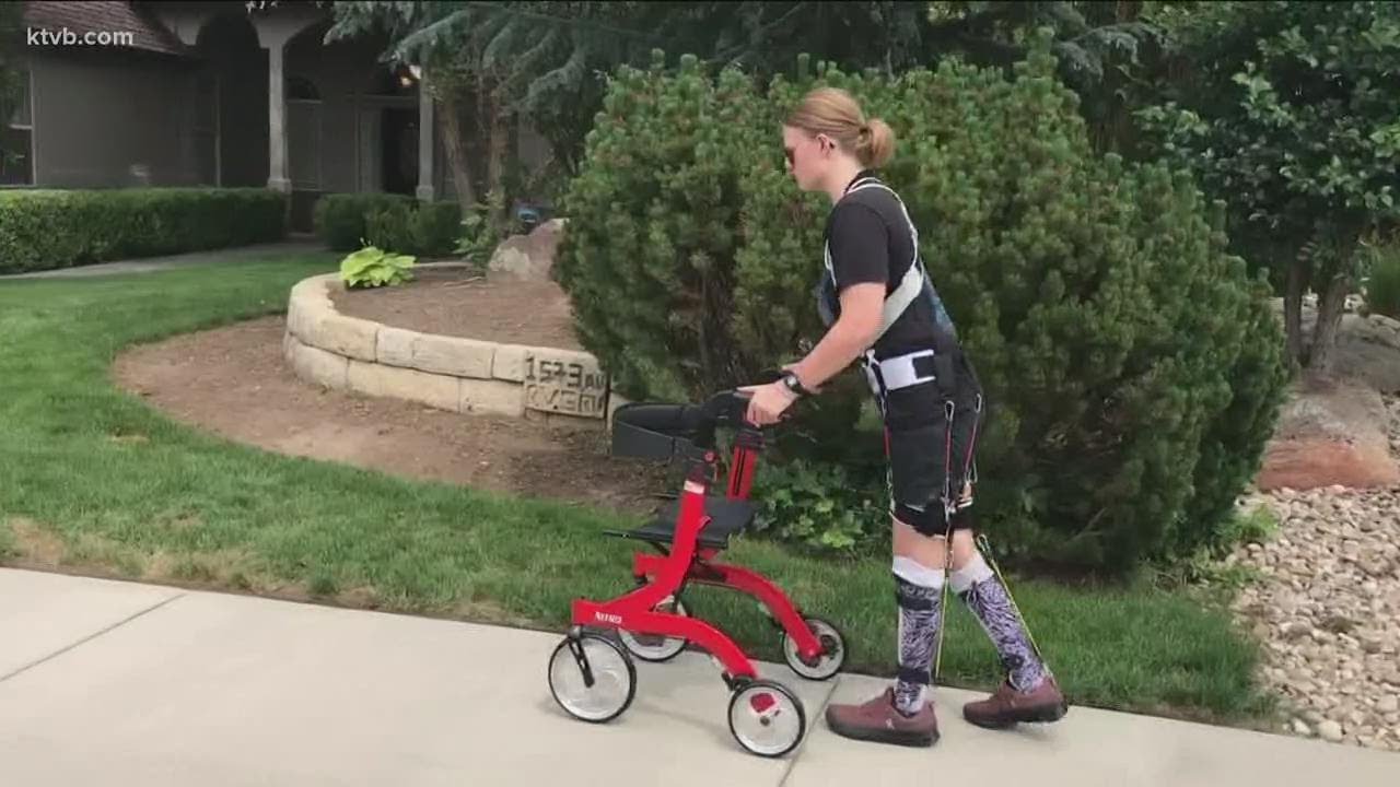 Woman injured in helicopter crash that killed her father gets device meant to help her walk again