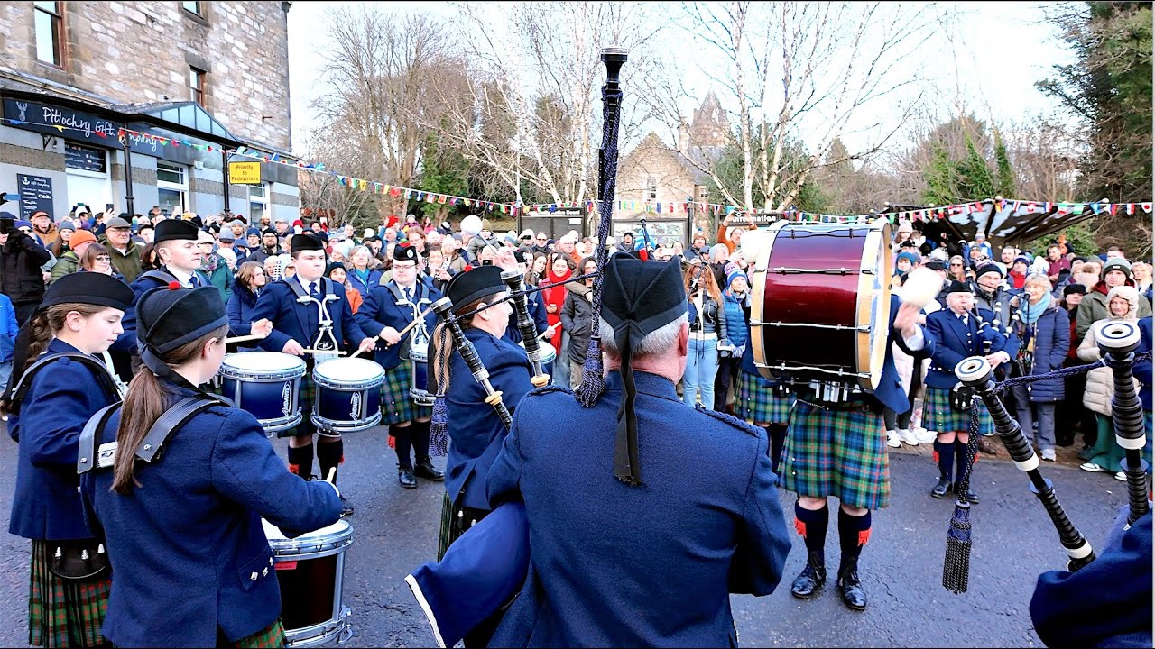 Vale of Atholl Pipe Band play Highland Cathedral at Pitlochry New Year 2025 street party in Scotland