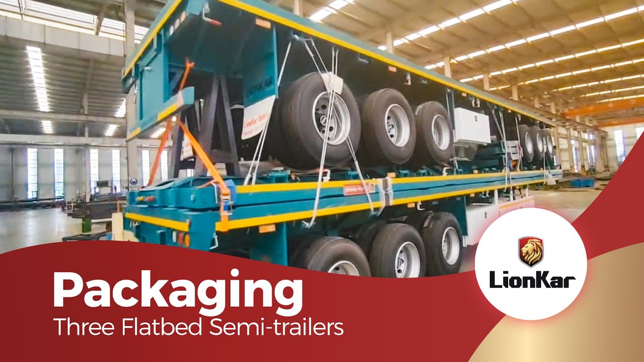 Three units of 3-axle flatbed semi-trailers are being prepared for shipment.