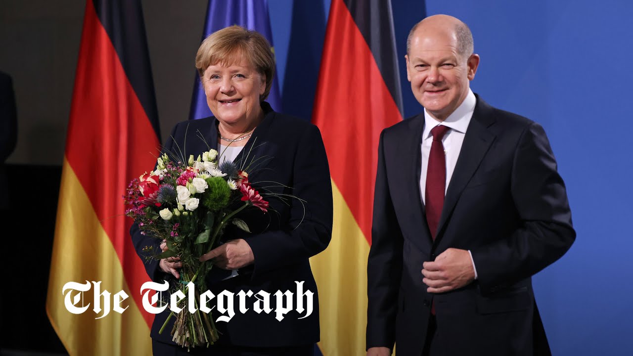 Olaf Scholz takes over from Angela Merkel as German chancellor