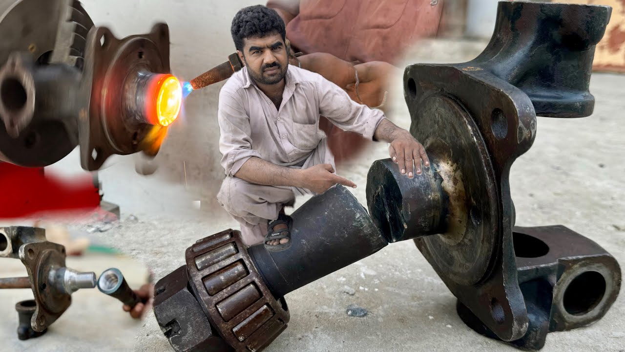 The Broken Wheel Spindle of Heavy Truck is Repair By Talented Mechanic Most Strongly…