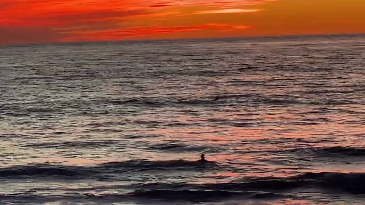 Chris cold plunging at Windansea 60 degrees at sunset 