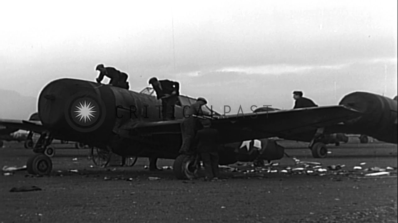 Men work on P-47 Thunderbolt fighter planes at Lagford Lodge in Belfast, Ireland. HD Stock Footage